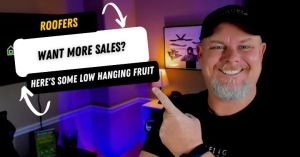 Smiling man pointing at a sign about low hanging fruit for roofers.