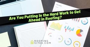 Business meeting with roofing charts, notebooks, and a laptop on a desk.