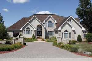 Beautiful large house with new roof and well-maintained front yard in a suburban neighborhood.